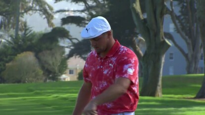 Bryson DeChambeau sinks a birdie putt on 13