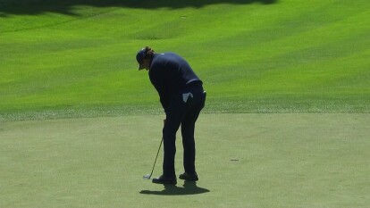 Phil Mickelson makes a birdie putt on 16