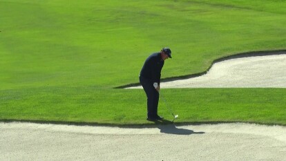 Phil Mickelson with a nice chip up on 16