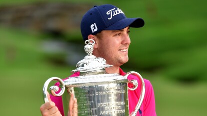 Justin Thomas poses with the Wanamaker Trophy