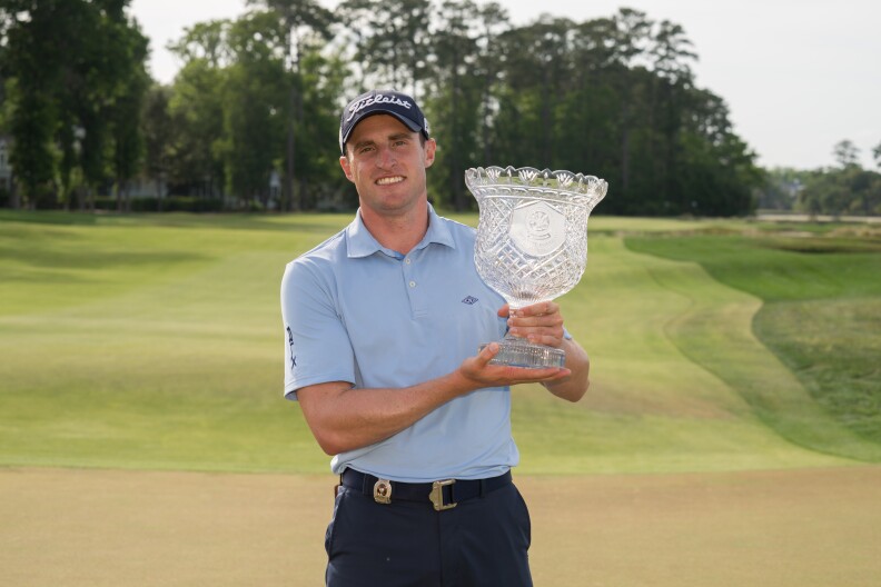 Alex Beach holds the trophy after winning the 2019 PGA Professional Championship