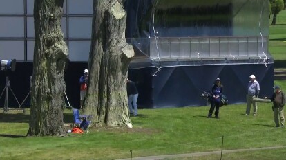 Harold Varner III: Puts it on green from behind tree