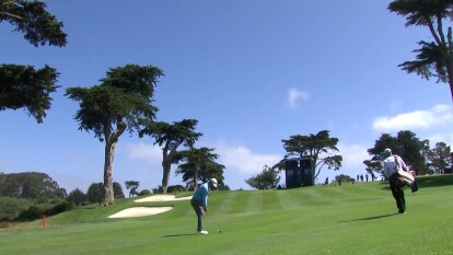 Jon Rahm has a tight approach on 18