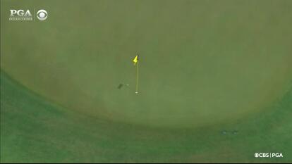 Phil Mickelson throws a dart from the sand to set up birdie