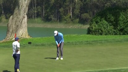 Jon Rahm has a birdie putt on 18